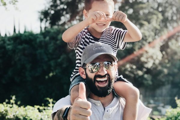 Man Carrying his Son over the Shoulders